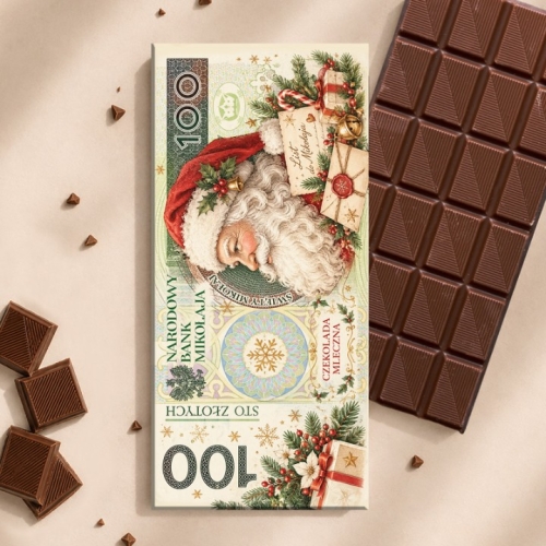 Czekolada mleczna na Święta w ozdobnym opakowaniu przypominającym banknot 100 zł z Mikołajem i prezentami.