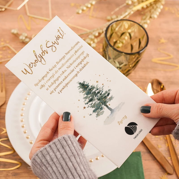 Opłatek wigilijny z logo firmy i życzeniami świątecznymi.