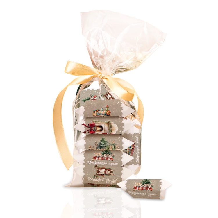 Celofanowy woreczek z krówkami świątecznymi.